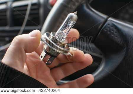 Close Up View Of The Burnt Out Spiral Of A Nichrome Filament Of A Car Lamp In The Driver Hand, Locat