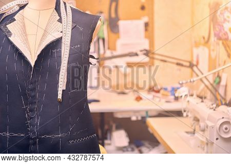 Semi-ready Jacket On Mannequin With Measuring Tape Across Neck. Suit Tailoring In Process Of Custom-
