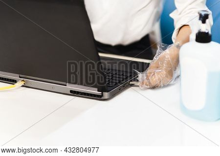 Hygiene Health Care Concept Man Hand With Gloves Insert Usb Flash Drive Into A Laptop.