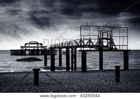 Remains Of The Old West Pier On Cold And Wet Day On Beach In Brighton, England, Uk