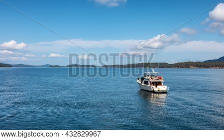 Boat Near The Shore On Pacific Ocean West Coast. Sunny Summer Day. Fernwood Point Beach, Salt Spring