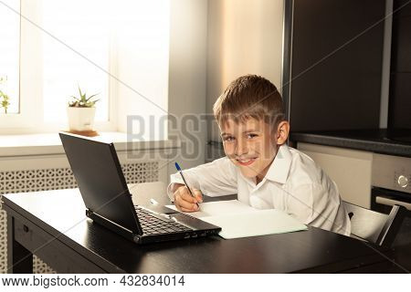 The Child Is Happy About The New School Year. Remote Lesson At School