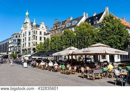 Copenhagen, Denmark - Septmeber 13, 2021: People In Outdoor Cafes In The Historic City Centre On A S