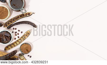Organic Carob Pods, Powder And Carob Molasses On A Beige Background, Locust Bean Healthy Food, Cerat