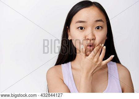 Silly Young Asian Woman Poking And Sqeezing Her Face, Pucker Lips Cute, Making Funny Adorable Facial