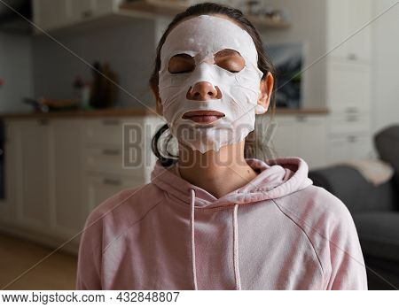 Young Woman With Beauty Mask At Home. Snackable Wellness Concept. Relaxation At Home For Young Mothe