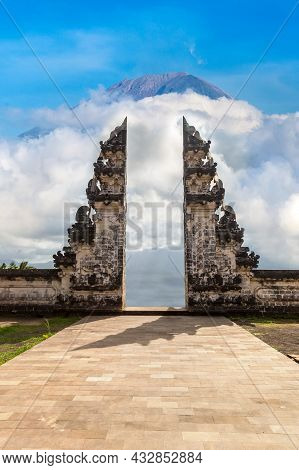 Ancient Gate At Pura Penataran Agung Lempuyang Temple And Volcano Agung On Bali, Indonesia In A Sunn