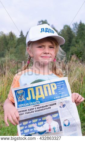 Russia - August 27, 2021. Tver Region. A Girl In A White Cap With The Inscription \