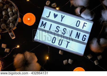 Lightbox With Text Jomo Joy Of Missing Out. The Concept Of Relaxation From Information And Gadgets. 