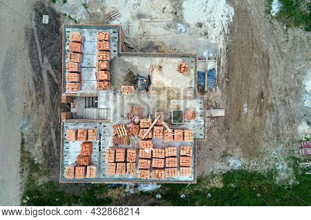 Top Down Aerial View Of Building Works Of New House Concrete Foundation On Construction Site.