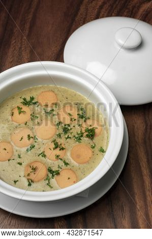 German Traditional Kartoffelsuppe Potato And Sausage Soup On Wood Table Background