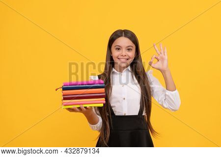 Bookish Kid In Grammar School. Happy Teen Girl Hold Books Heap. Perfect Education