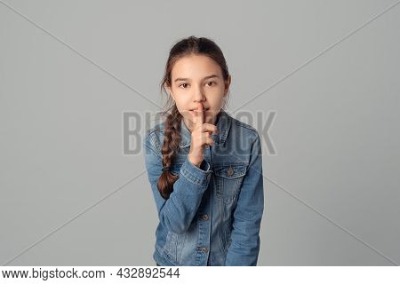 Young Girl Holds Finger To His Mouth, Shows Tss, Shh, Asks To Remain Silent About Her Mistake, Isola