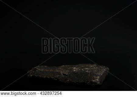 Rock Podium On The Black Background. Stone Podest For Product, Cosmetic Presentation. Creative Mock 