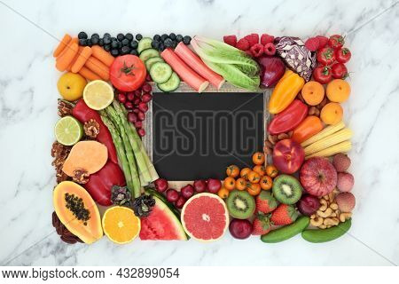 Antioxidant health food to reduce blood pressure and cholesterol levels high in anthocyanins, carotenoids, vitamins, protein, omega 3, fibre,  smart carbs. Blackboard with copy space on marble.  