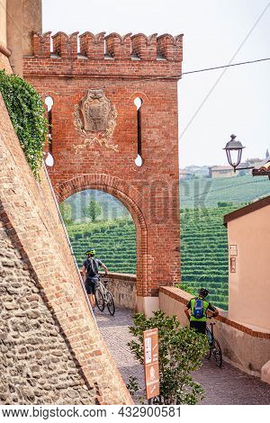 Barolo, Italy - September 10 2021: Group Of Cyclists In Narrow Streets Of Barolo, Piemonte, Langhe W