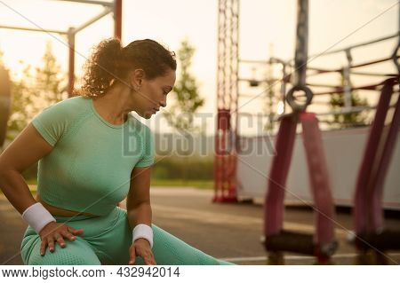 Close-up Of Attractive Athlete Woman Doing Warm-up, Warming Up Before Training Outdoors In Summer Sp