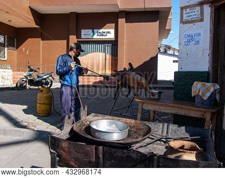 Nabon, Ecuador - September 5, 2021: Man Prepares Chancho Hornado Or Roasted Pig Which Is Typical Ecu