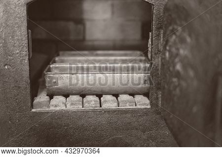Bread Tins In A Vintage Brick Oven - Monotone Image In Intentional Shallow Depth Of Field