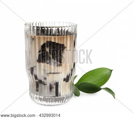 Glass Of Milk With Grass Jelly And Green Leaves On White Background