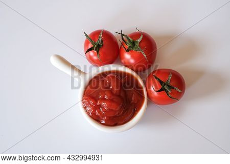 Fresh Otento Sweet Diamond Tomatoes Or Cherry Tomatoes And A White Dipping Bowl Full Of Ketchup Isol