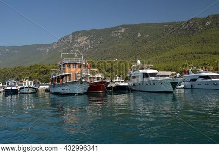 Boats and yachts at the in the marina of village Akyaka - slow city in Turkey.August 1,2021. Mugla,Turkey