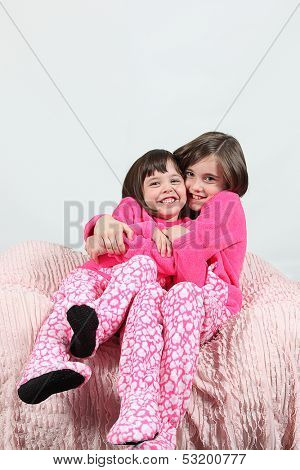 Adorable little girls posing for photos in PJ's