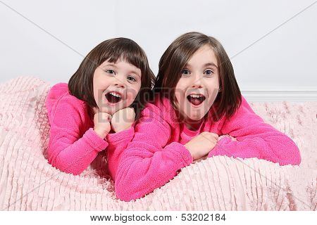 Adorable little girls posing for photos in PJ's