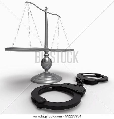 Scales of justice and handcuffs concept