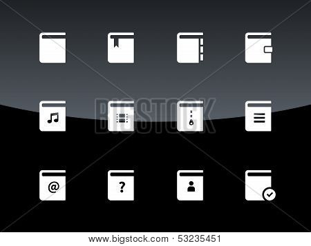 Book icons on black background.