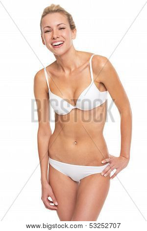 Portrait Of Smiling Young Woman In Lingerie