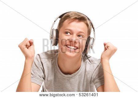 Smiling Teenage Boy Listening To Music