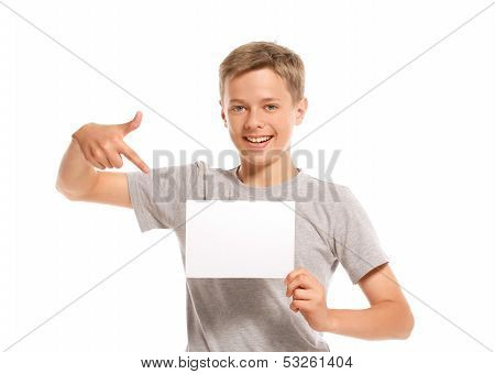 Smiling Boy Pointing At White Blank Paper