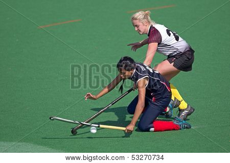 BLOEMFONTEIN, SOUTH AFRICA - AUGUST 7: Unidentified players during a womenâs field hockey match between the North West and Free State Universities, on Aug 7., 2010 in Bloemfontein, South Africa.