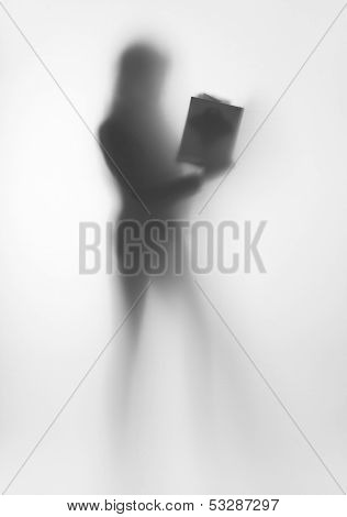 Diffuse woman body shape silhouette, with book in hands