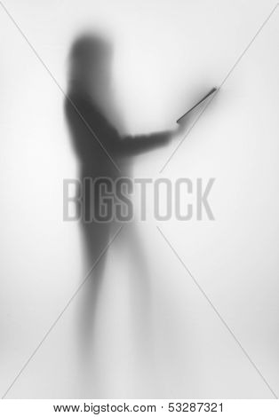 Diffuse woman body shape silhouette, with book in hands
