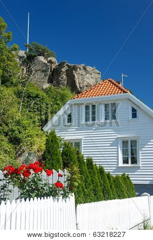 Traditional white wooden house in Norway