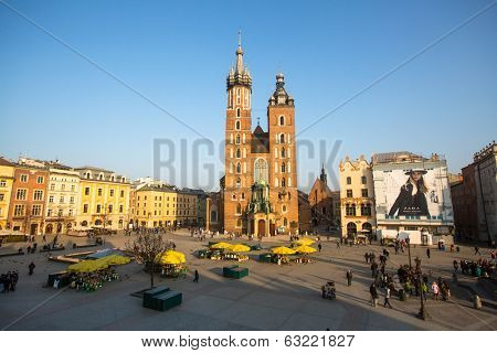 KRAKOW, POLAND - FEB 26, 2014: View of the Main Square. It dates to the 13th century, and at roughly 40,000 m it is the largest medieval town square in Europe.