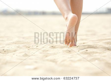 Woman Barefoot Walking On Beach