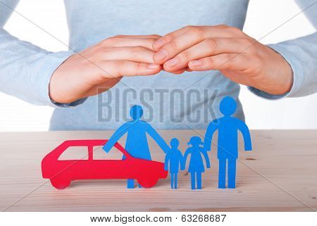 Hands Guarding Family And Car