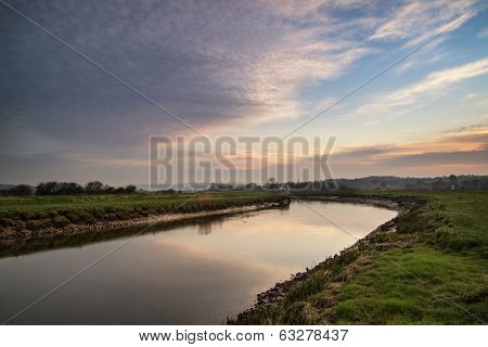 Stunning Vibrant Sunrise Reflected In Calm River