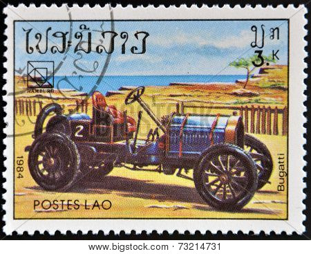 LAOS - CIRCA 1984: A stamp printed in Laos shows retro car Bugatti circa 1984.