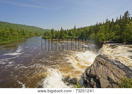 Looking Downriver From A Wilderness Falls