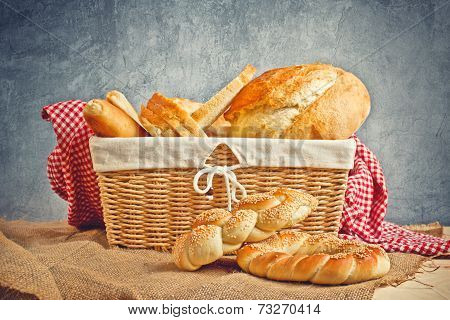 Delicious Bread And Rolls In Wicker Basket
