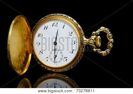 Gold Pocket Watch On A Black Background