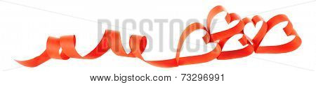 Heart shaped red paper ribbon isolated on white