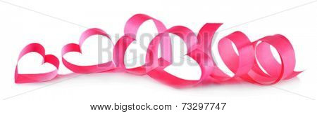 Heart shaped pink paper ribbon isolated on white