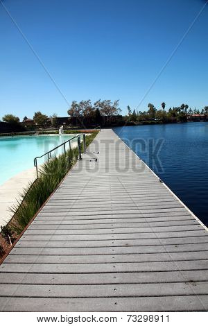 Private Lake with homes and boats in Lake Forest California. Lake Forest has many Private Lakes with limited access to the general public, making it an ideal and serene location to live life. 