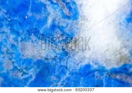 Macro Beautiful fantastic background from Lazurite is a tectosilicate mineral with sulphate, sulphur