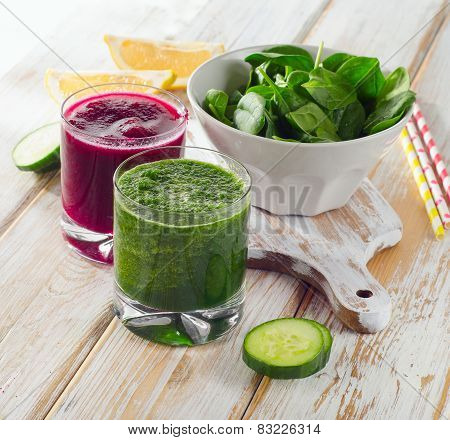 Freshly Squeezed Vegetable Juices On A Wooden Background